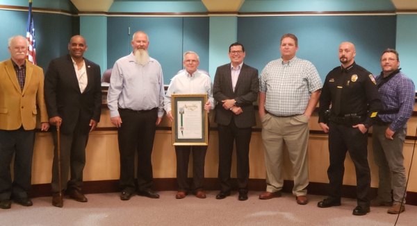 Fellow council members and city staff join Assemblymember Rudy Salas as he honors Council Member Dave Brown as 2019 Veteran of the Year.